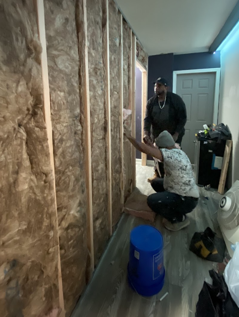 Danbury Construction team working on an interior wall